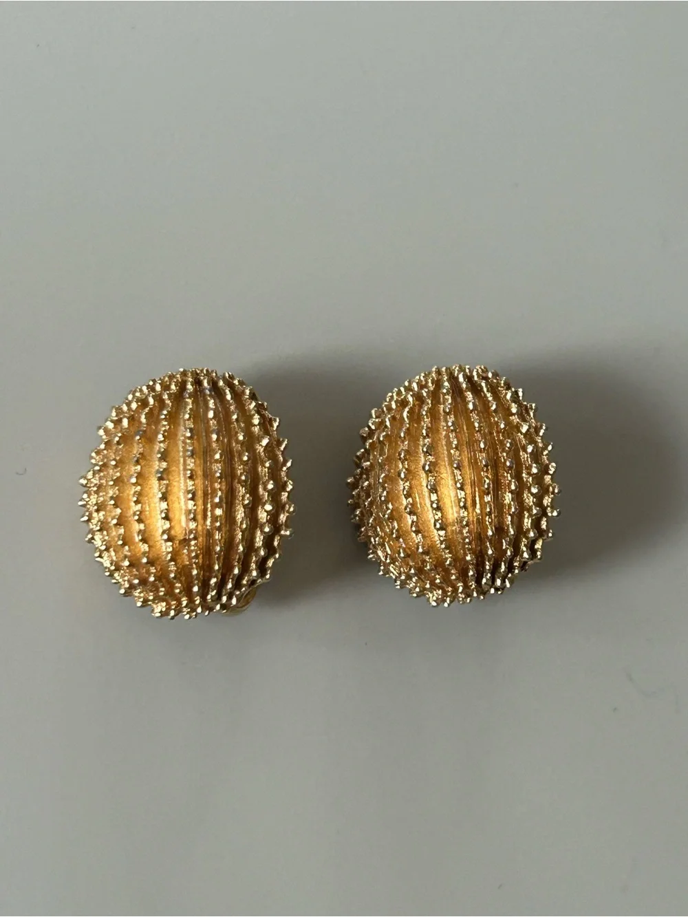 2 pairs of #CrownTrifari Clip-on Earrings. Gold-Tone Ribbed Domes and Florals.